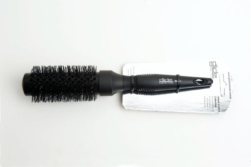 Black hairbrush with packaging on a white background