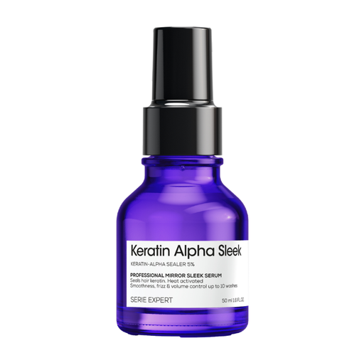 A bottle of Serie Expert Keratin Alpha Sleek serum, featuring a vibrant cobalt blue glass bottle with a black spray nozzle and a white label.