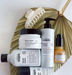 L'Oreal Metal Detox hair care products on a white background with a decorative leaf