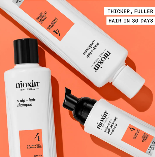 Nioxin hair care products on an orange background with text about hair growth.
