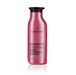 Red shampoo bottle with black cap on a white background