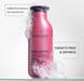 Pink shampoo bottle with text about sulfate-free shampoo on a white background